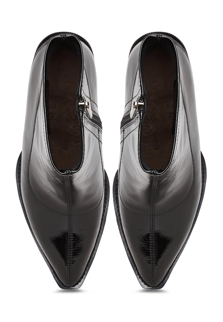 A close-up image of Layla women's leather block heel boots in a stylish patent black design, showcasing the chunky heel detail.