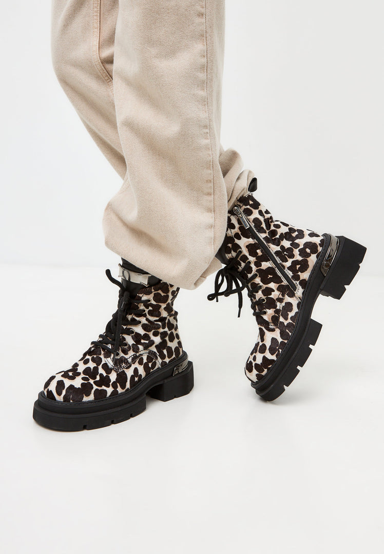 A stylish pair of classic leather platform ankle boots with a fierce Luna leopard print design for a trendy and bold look.