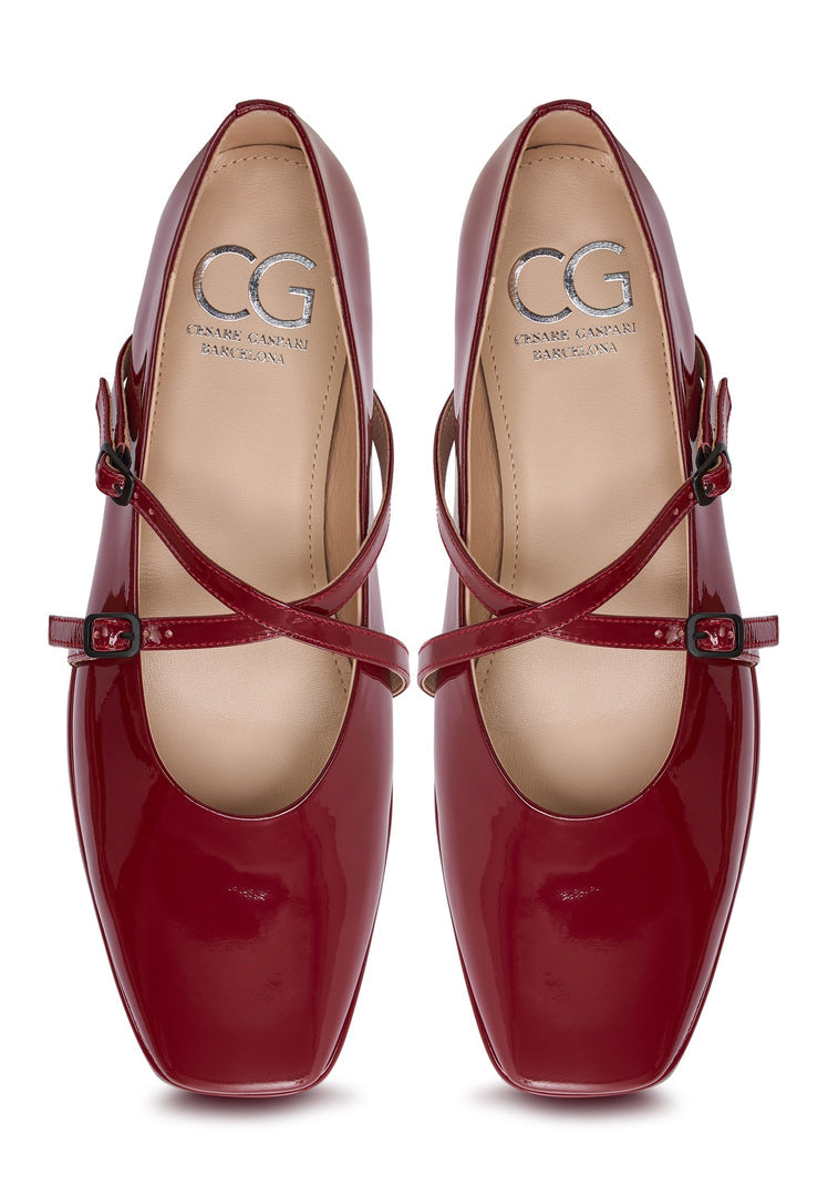 A pair of stylish red leather ballerinas, also known as Albina flats, ideal women's shoes for any occasion.