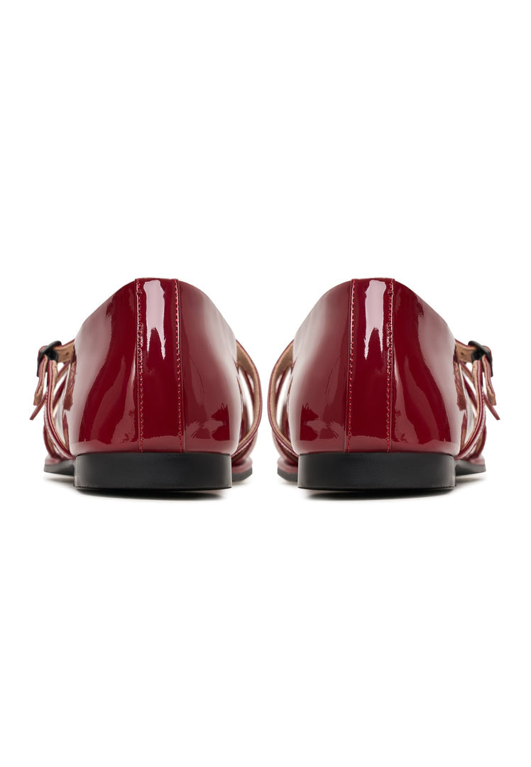 A pair of red leather ballerinas, also known as Albina ballerinas, are elegant women's shoes perfect for any occasion.