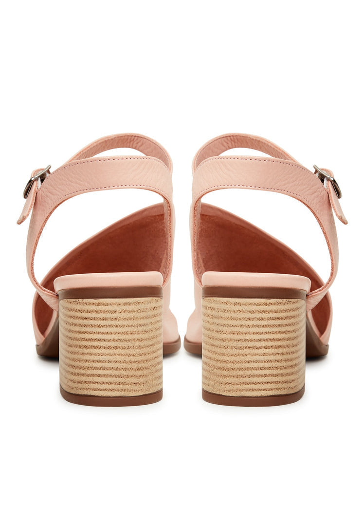 A pair of stylish women's pink leather block heel sandals featuring a chunky heel design, perfect for adding a touch of sophistication to any outfit.