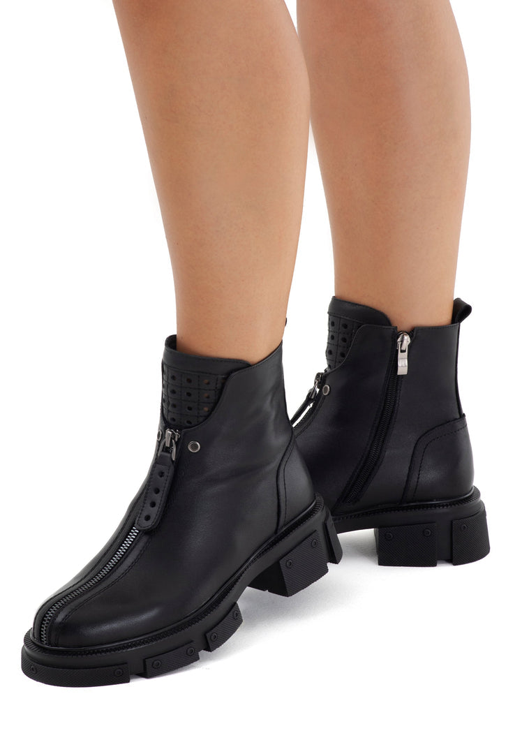 A stylish pair of classic block heel ankle boots for women, perfect for a fashion-forward look.