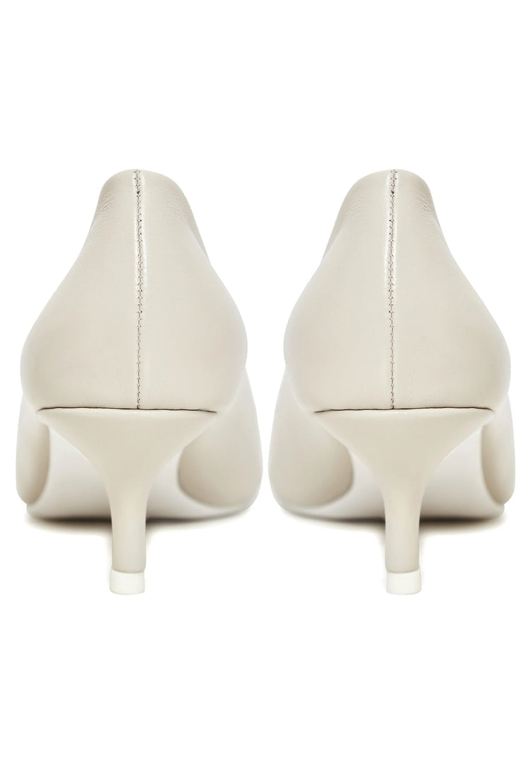 A pair of elegant off white pumps, perfect luxe heels for a designer touch or as white wedding heels.