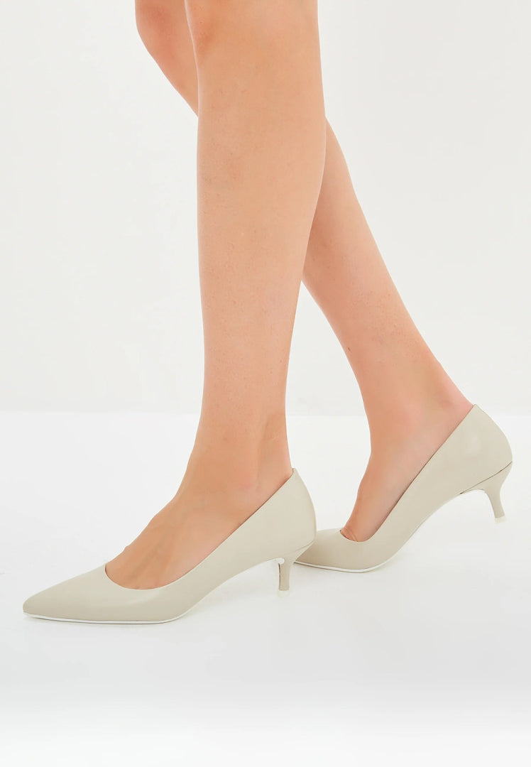 A pair of elegant luxe off white pumps, perfect as luxe heels or designer pumps for a white wedding.