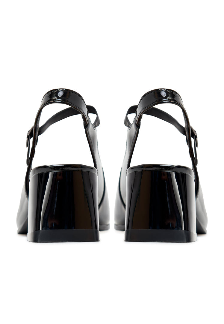 A close-up image of chic black slingback pumps by Nina, the perfect designer heels for sophisticated women's outfits.