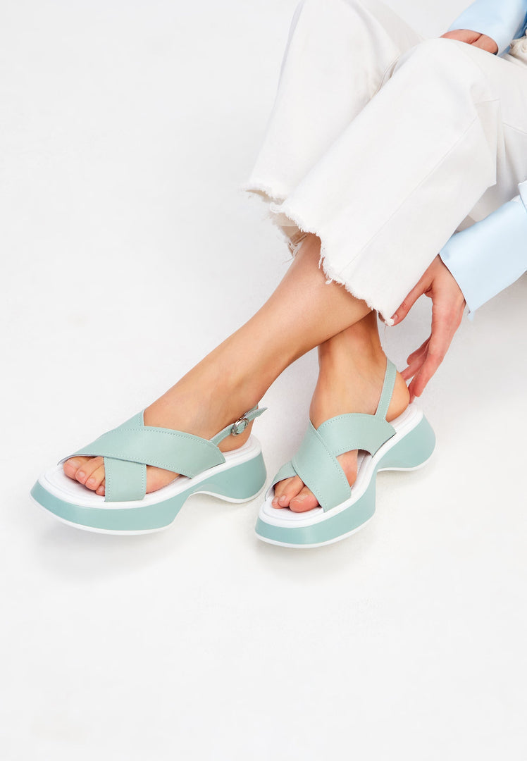 A stylish pair of green leather platform Tuti sandals, perfect for summer, designed for women.