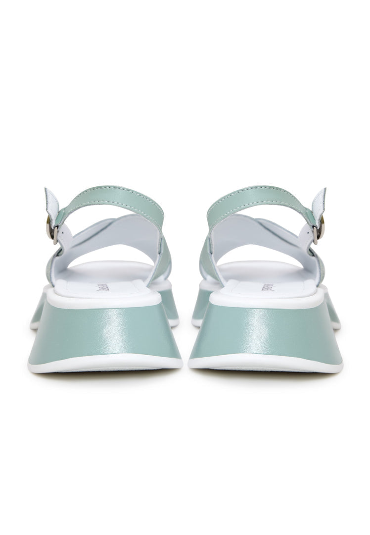 A trendy pair of green leather platform Tuti sandals for women - the perfect choice for stylish summer footwear.
