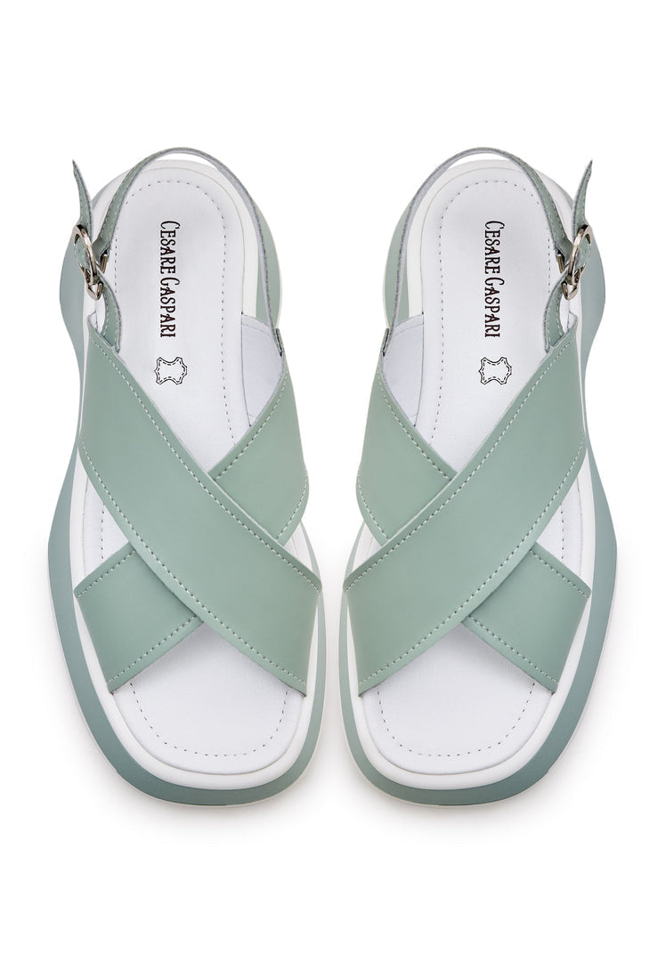 A pair of stylish green leather platform Tuti sandals, perfect for summer, with a chic design for women.