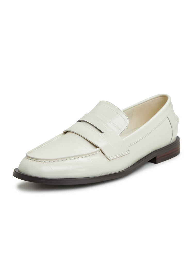 A stylish pair of white leather block heeled loafers, perfect for fashionable women's footwear.