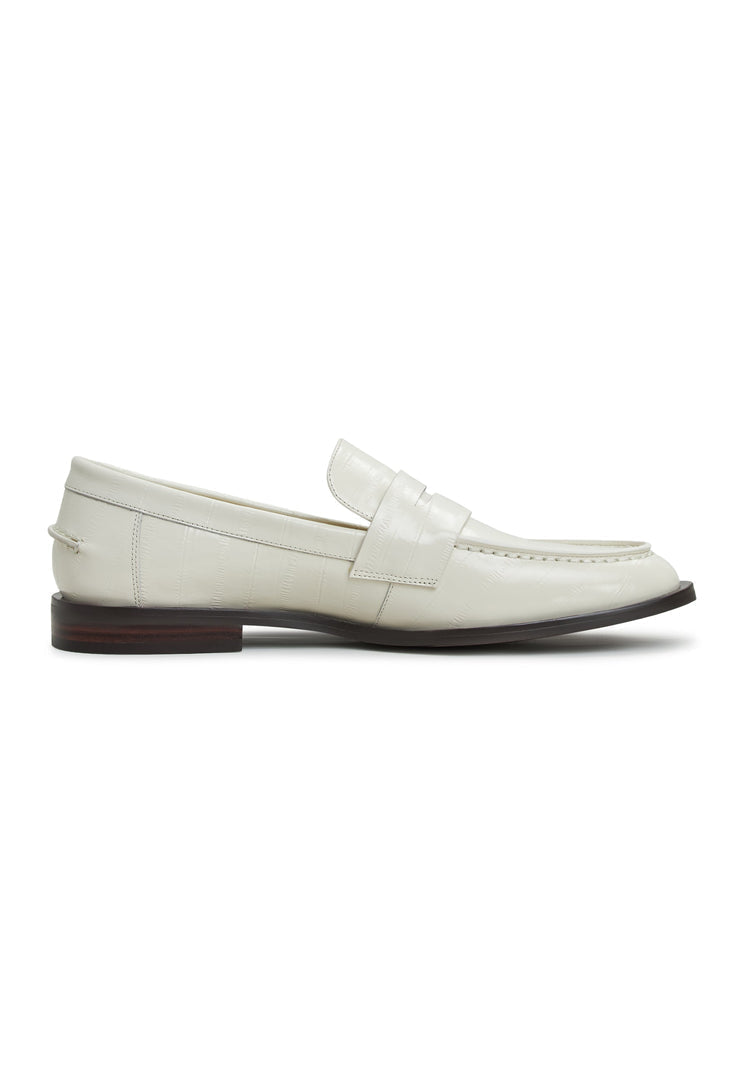 A stylish pair of women's white leather block heeled loafers, perfect for a fashion-forward look.