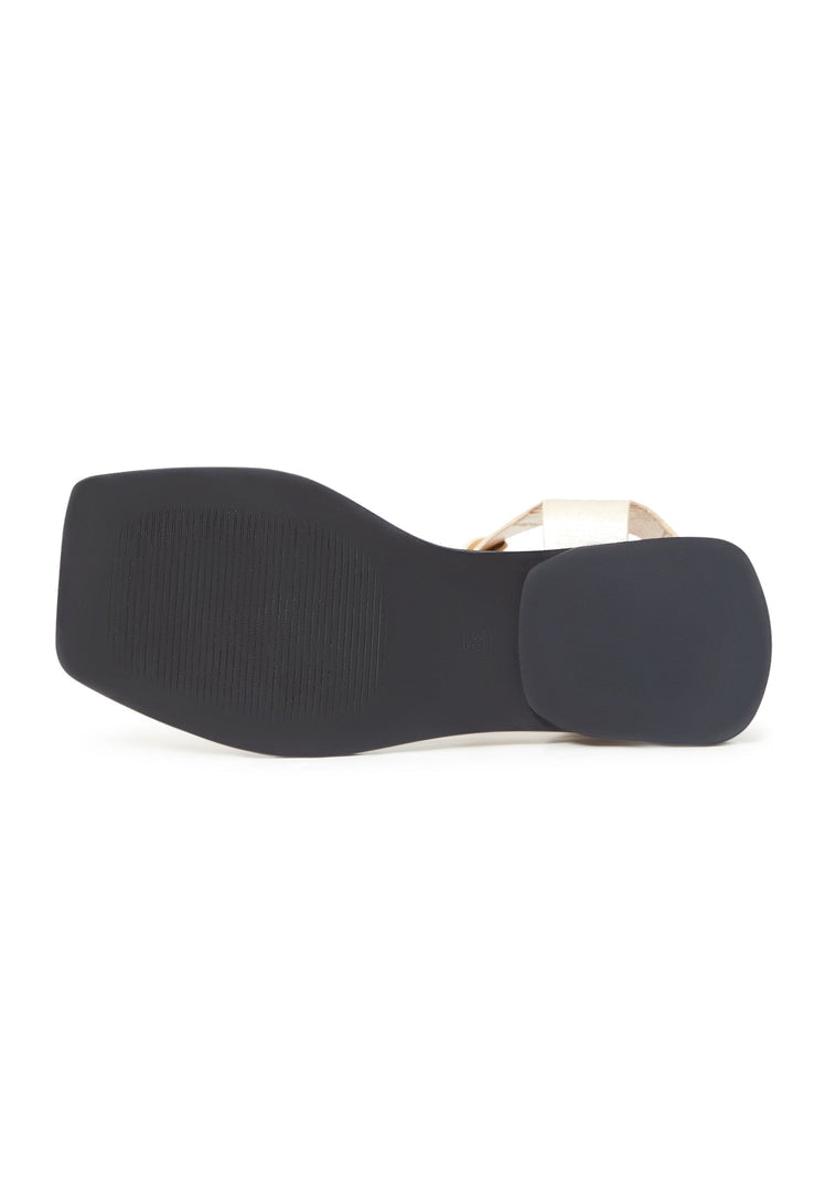 A pair of stylish gold ankle cuff flat sole sandals for women, perfect for summer footwear fashion.