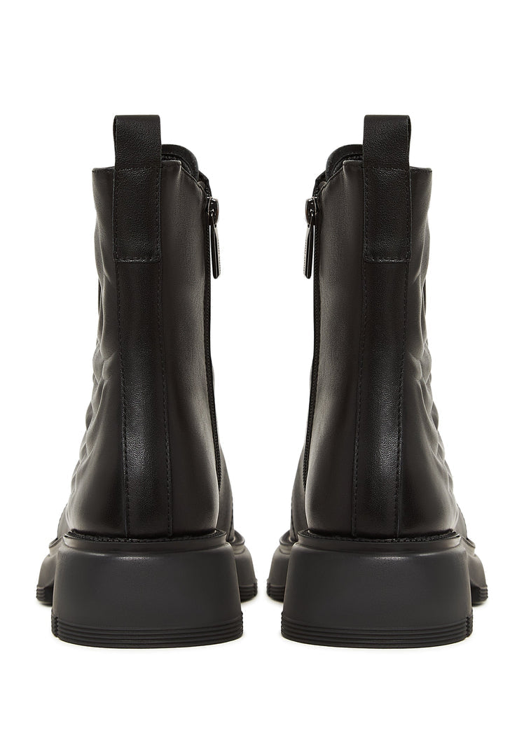 A stylish pair of black leather platform high heel ankle boots, the perfect fashionable choice for women.