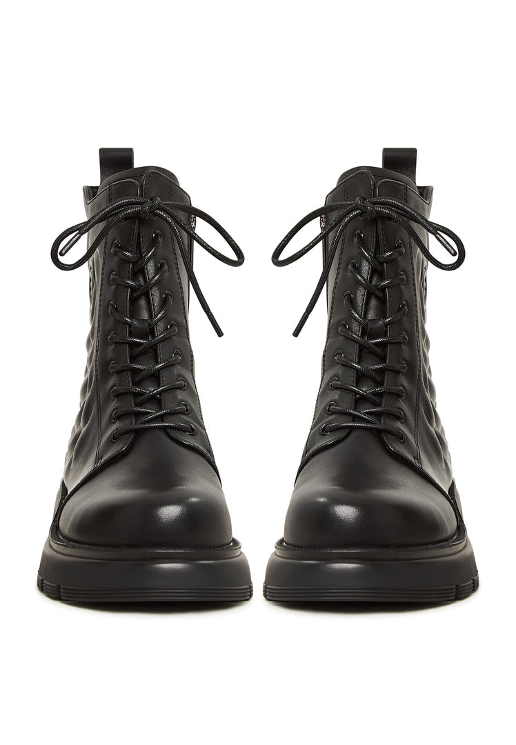 A stylish pair of black leather platform ankle boots, perfect for any woman looking for fashionable high heel ankle boots.