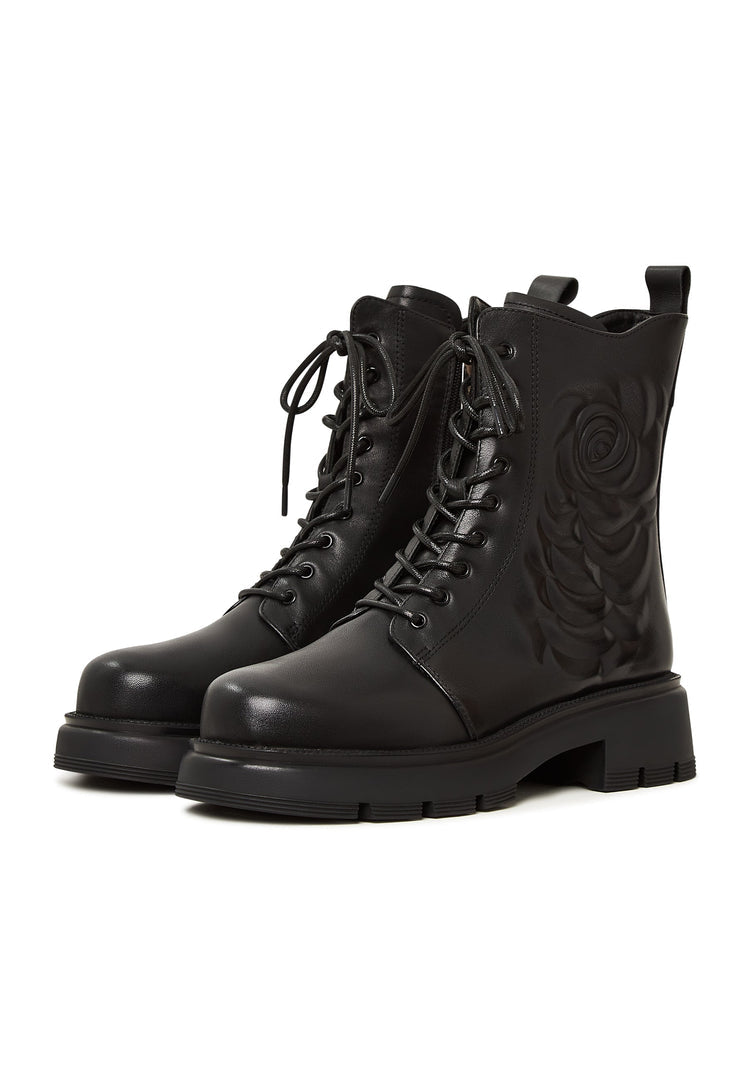 A stylish pair of black leather platform ankle boots for women, featuring high heels and a fashionable design.
