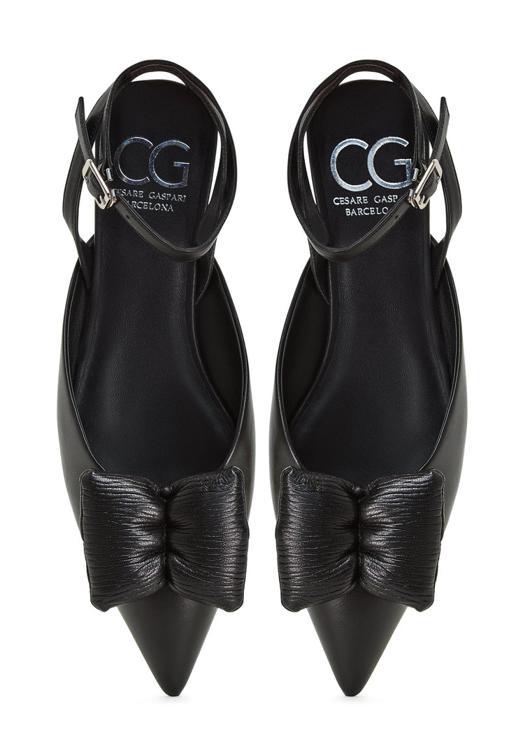 A pair of black Gabriela slingback ballerinas with a flat sole, perfect for women seeking comfortable black flats with a stylish touch.