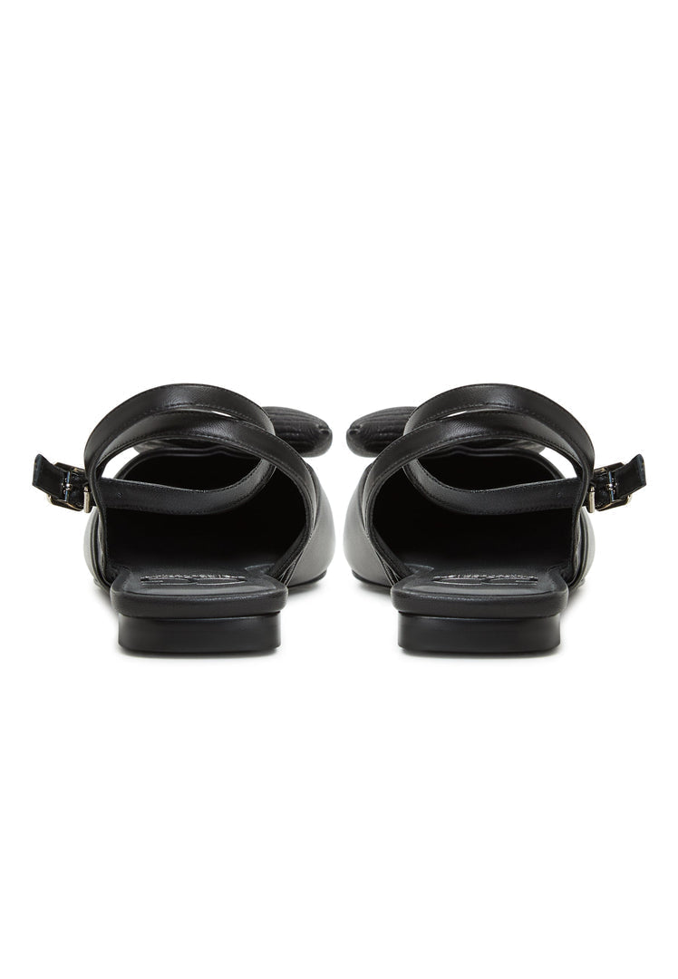 A pair of stylish and comfortable black slingback ballerinas with a flat sole, known as Gabriela black shoes, perfect for women seeking chic and comfortable black flats.