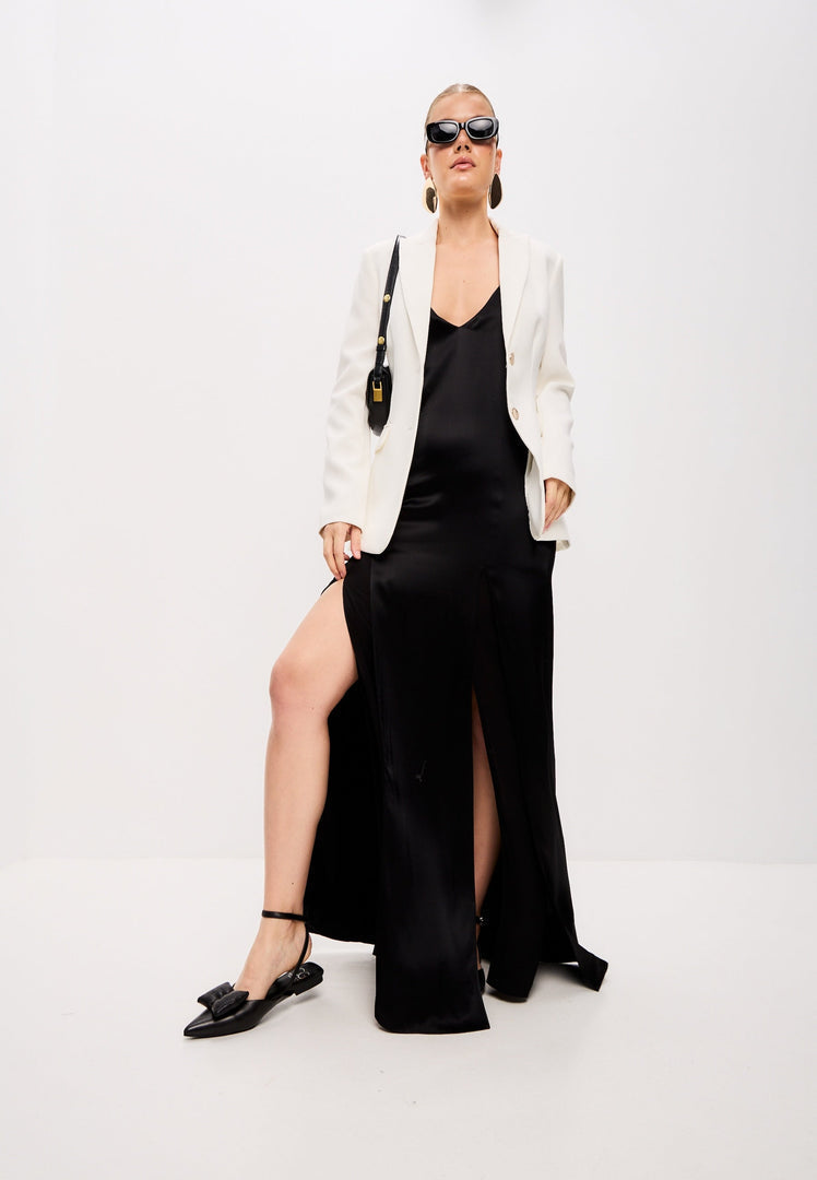 A stylish pair of black Slingback ballerinas with a flat sole, known as Gabriela black shoes, perfect for women looking for comfortable black flats.