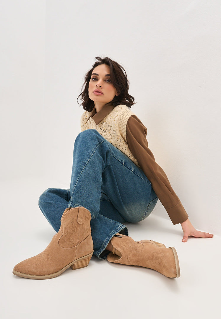 A pair of stylish suede cowboy boots in a rich Natalie brown color, exuding Western style charm and perfect for women looking for fashionable cowgirl boots.