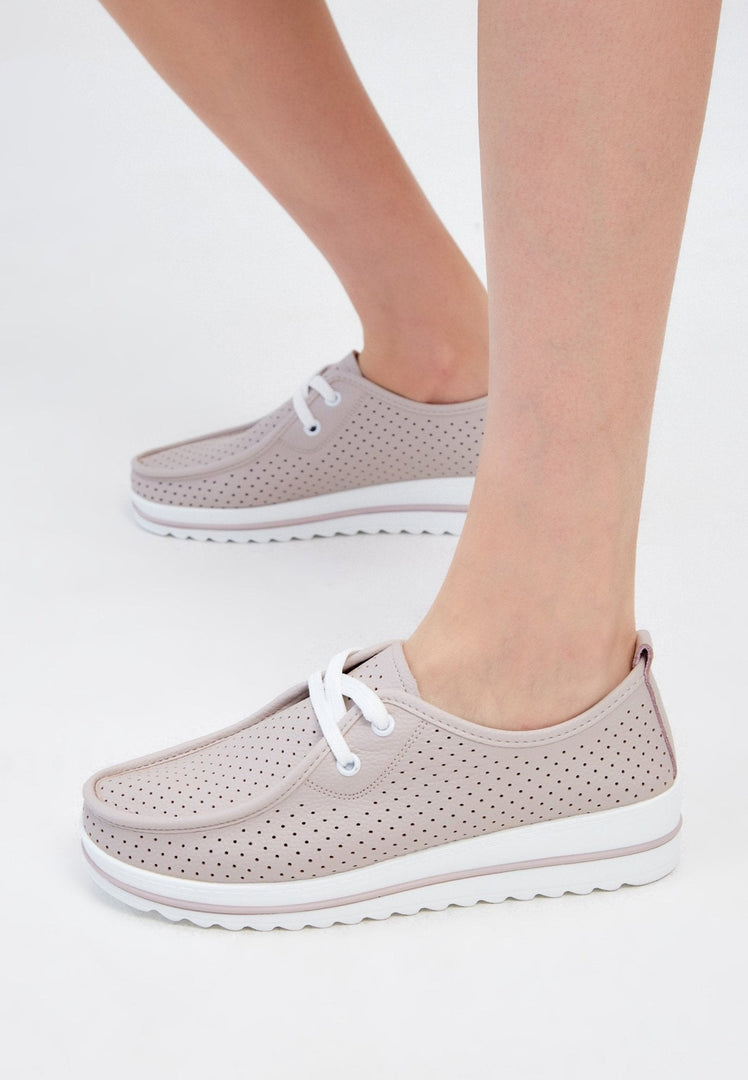 A stylish pair of beige leather platform loafers, perfect for women seeking comfortable and classic footwear.