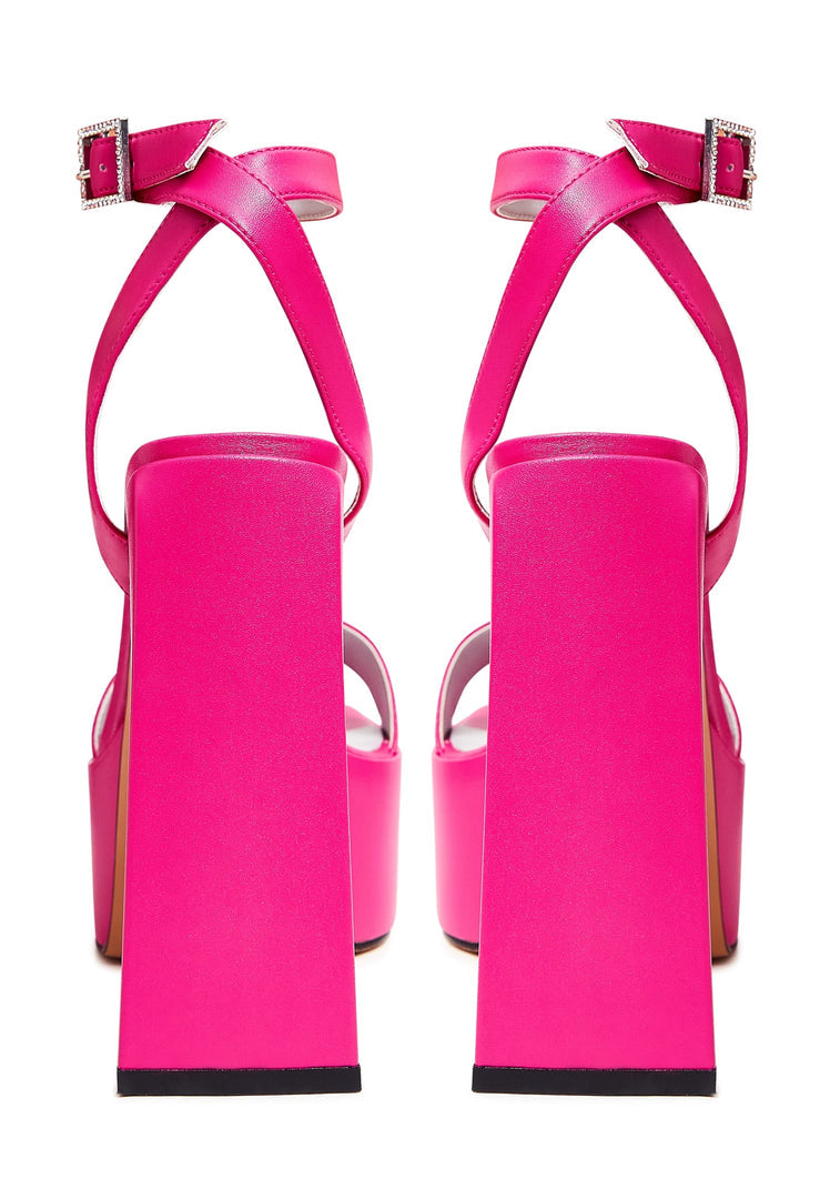 A pair of stylish women's pink sandals, perfect for summer days with their elevated elegance.