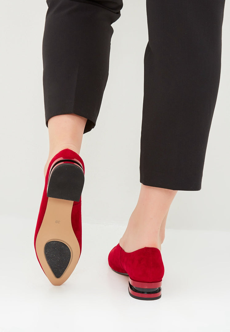 A stylish pair of black suede ballerinas with a pointed tip, perfect for women looking for chic and comfortable leather flat shoes.