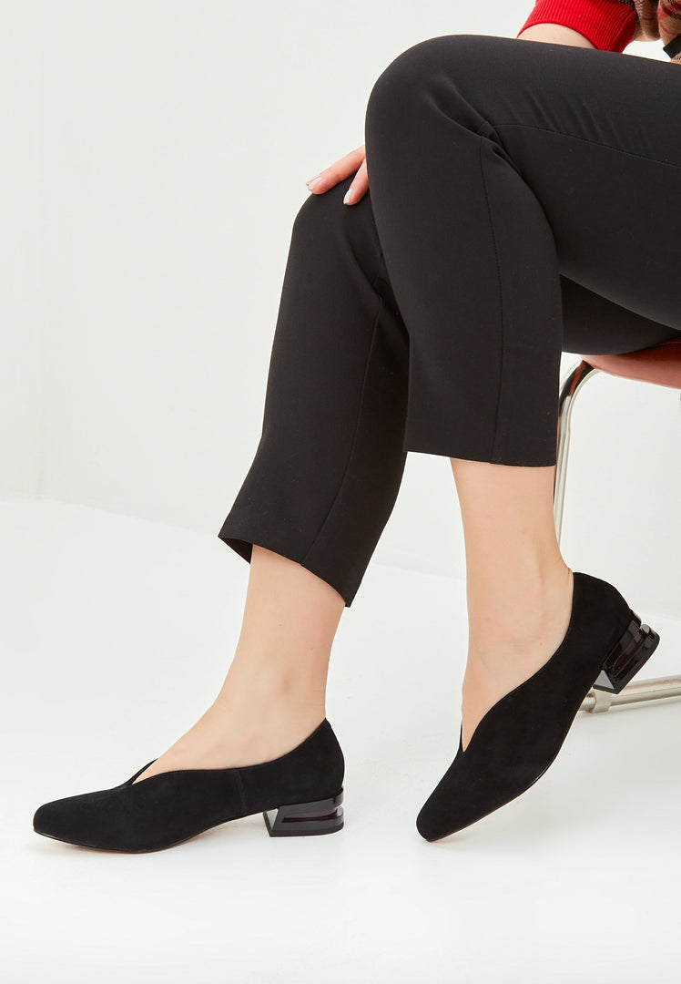 A collection of stylish pointed flats in black suede, perfect for women looking for comfortable and chic ballet flats.