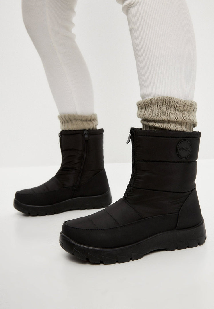 Stay warm and cozy this winter with waterproof insulated snow boots featuring fur lining and snow grips for extra traction.