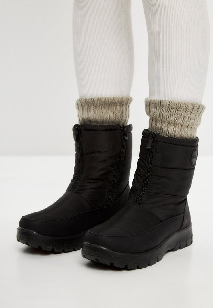 Stay warm and stylish this winter with a pair of waterproof, insulated snow boots featuring cozy fur lining and snow grips for added traction in cold weather.