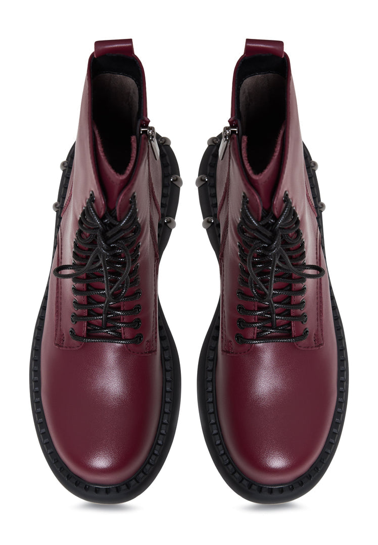 A stylish pair of Bordeaux lace-up combat boots with a chunky sole, perfect for women's fashion footwear.