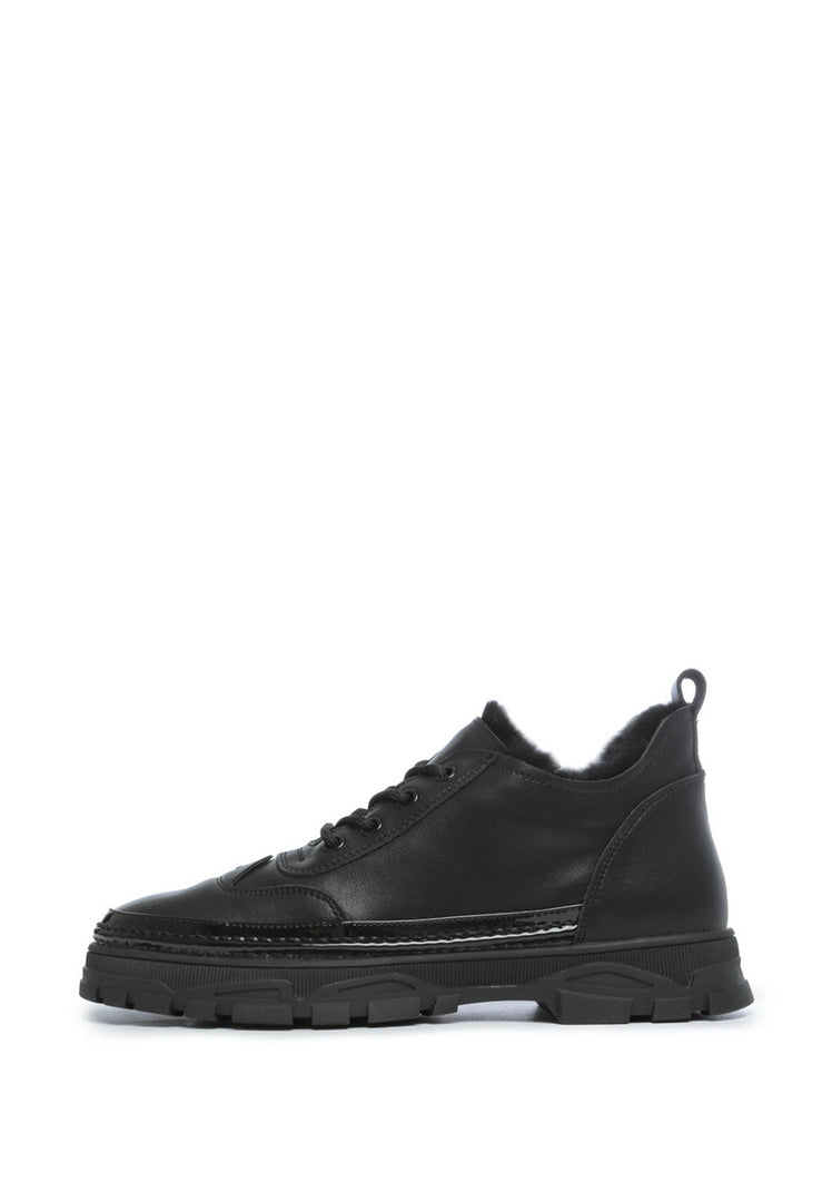 A pair of stylish chunky black sneakers made with comfortable Merino wool lining, perfect for keeping your feet cozy and fashionable.