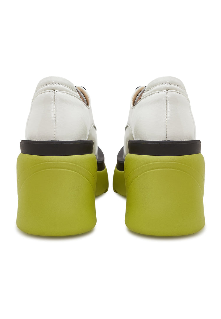 A fashionable pair of white block heel oxfords, ideal for a chic and stylish look.
