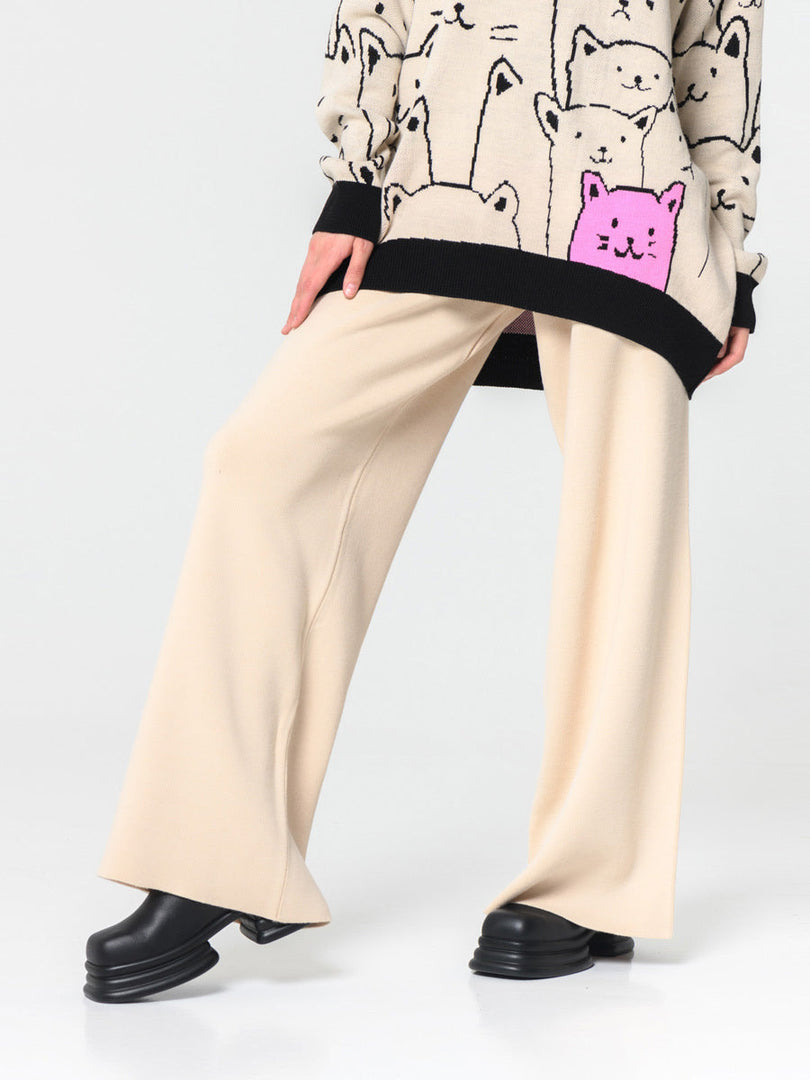 A woman lounging comfortably in stylish wide-leg lounge pants for women in a relaxed fit, perfect for a cozy day at home or casual outings.