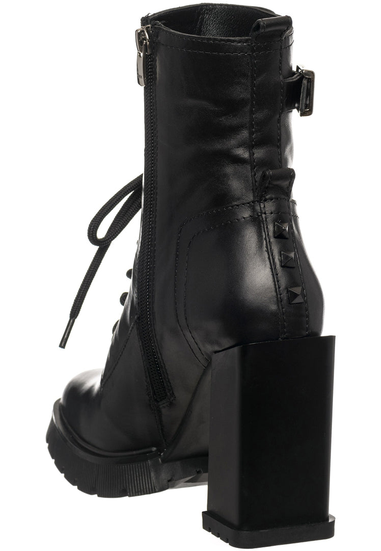 A fashionable pair of women's studded combat boots with a trendy heeled design, perfect for adding an edgy touch to any outfit.