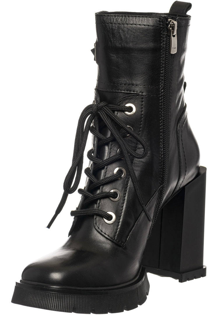A trendy pair of studded heeled combat boots for women, adding an edgy and fashionable touch to any outfit.