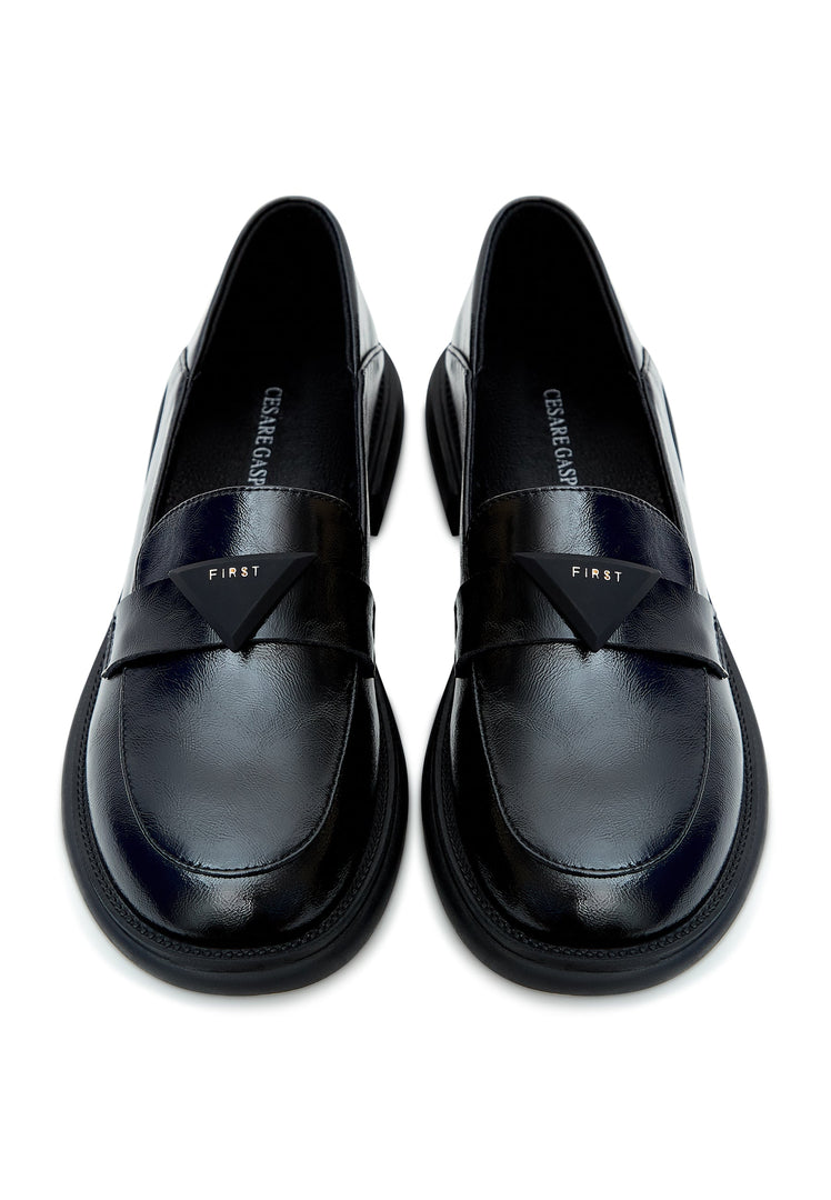 A sophisticated pair of black slip-on loafers - a must-have in every man's wardrobe for a classic and timeless look.