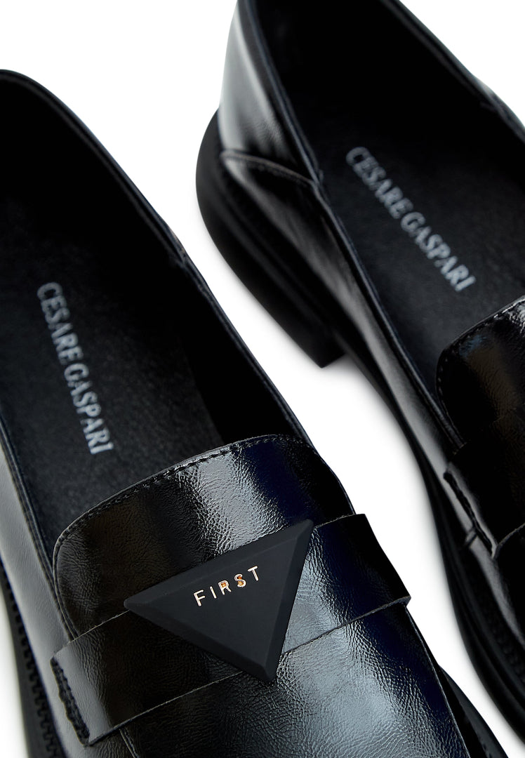 A sleek pair of black slip-on loafers, the perfect classic shoes for men.