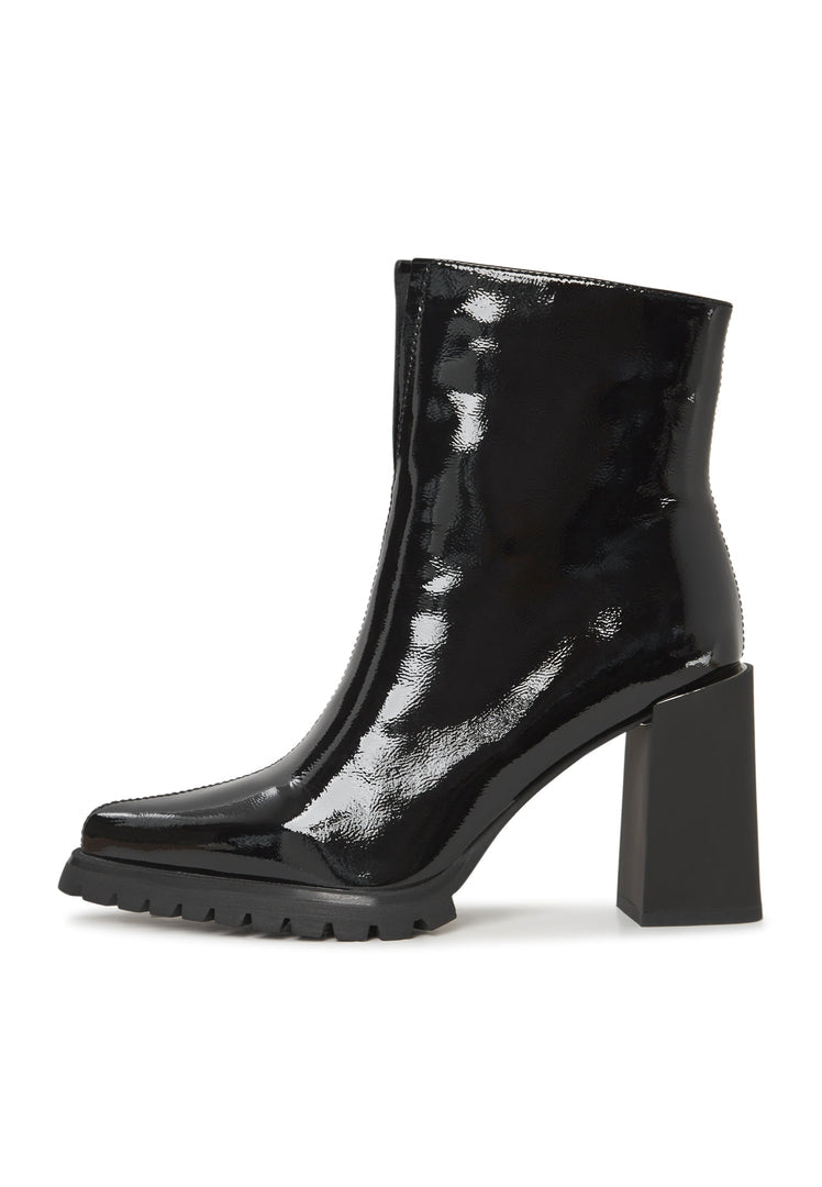 A trendy pair of black patent leather ankle boots - classic and stylish women's footwear.