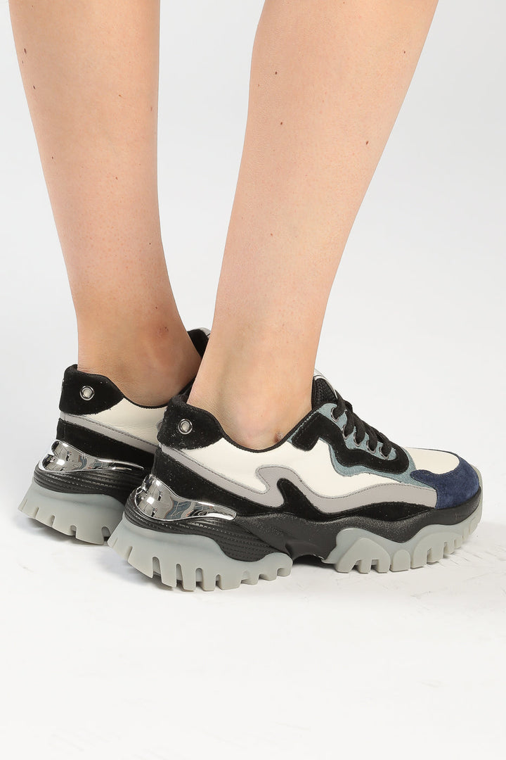 A trendy and fashion-forward pair of multi-panel chunky sneakers that make a bold statement.