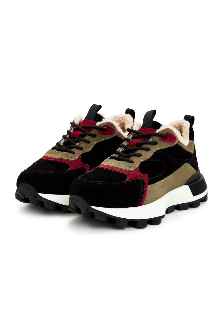 A pair of trendy brown chunky platform sneakers for women, making a fashionable statement.