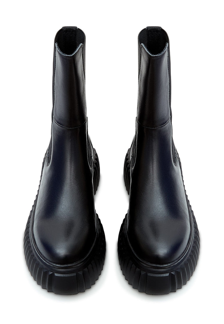 A pair of stylish women's black Chelsea boots with platform heels and a ribbed sole for a trendy and comfortable look.