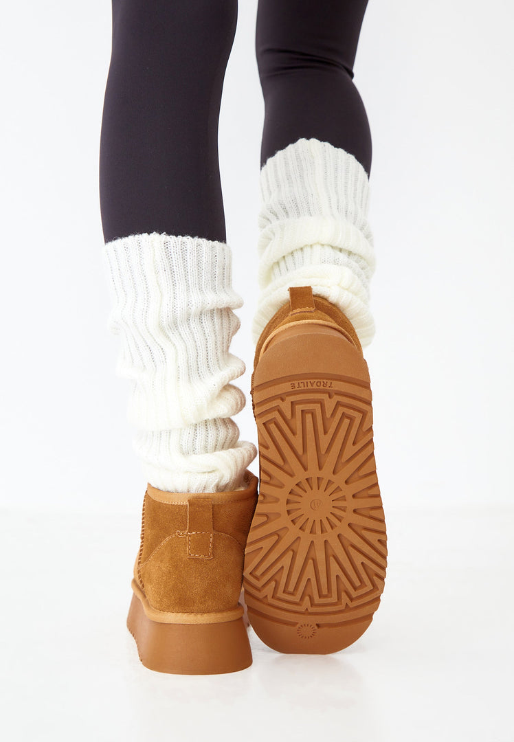 A trendy pair of brown suede platform winter boots, perfect for adding style and warmth to your winter fashion looks.