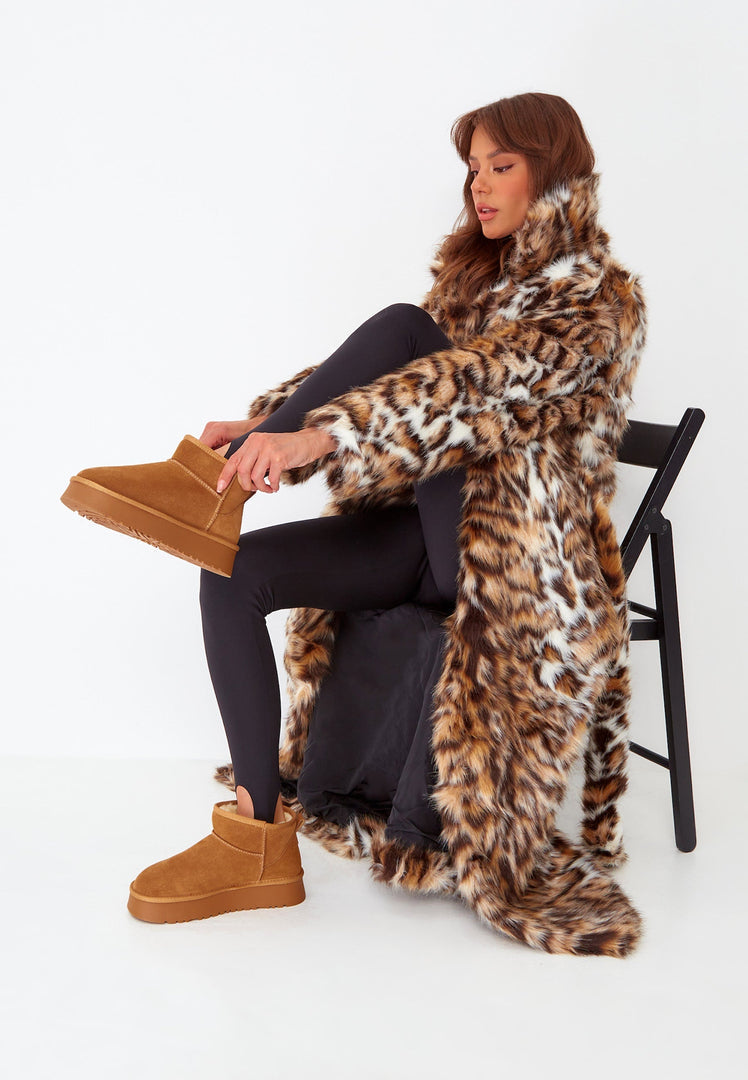 A pair of stylish brown suede platform winter boots - perfect for rocking the latest winter fashion trends.