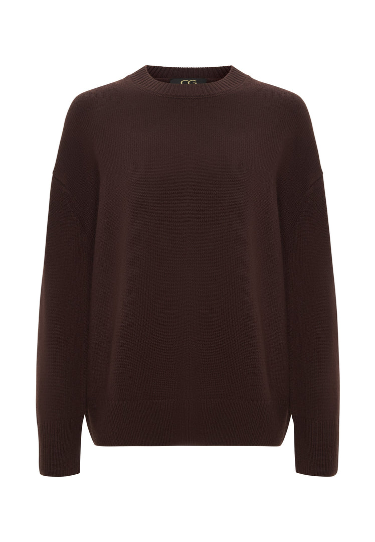 A woman wearing a classic crew neck Mulan Brown sweater - perfect for the winter season and casual knitwear fashion.