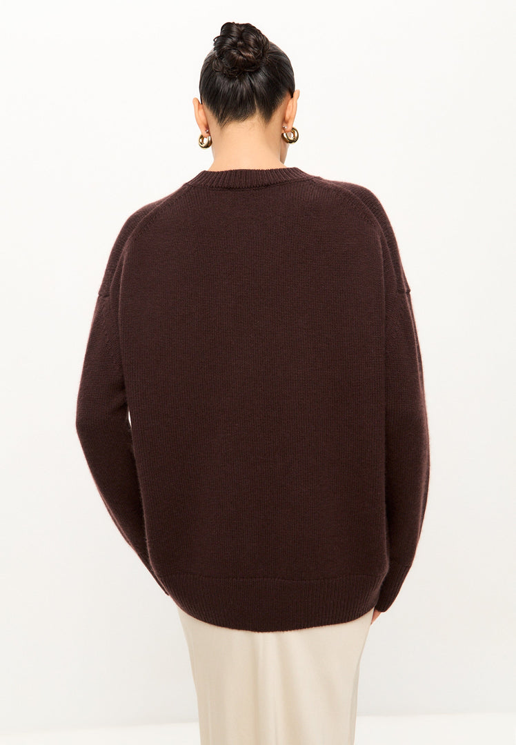 A cozy Mulan brown classic crew neck sweater for women, perfect for winter fashion and casual knitwear looks.
