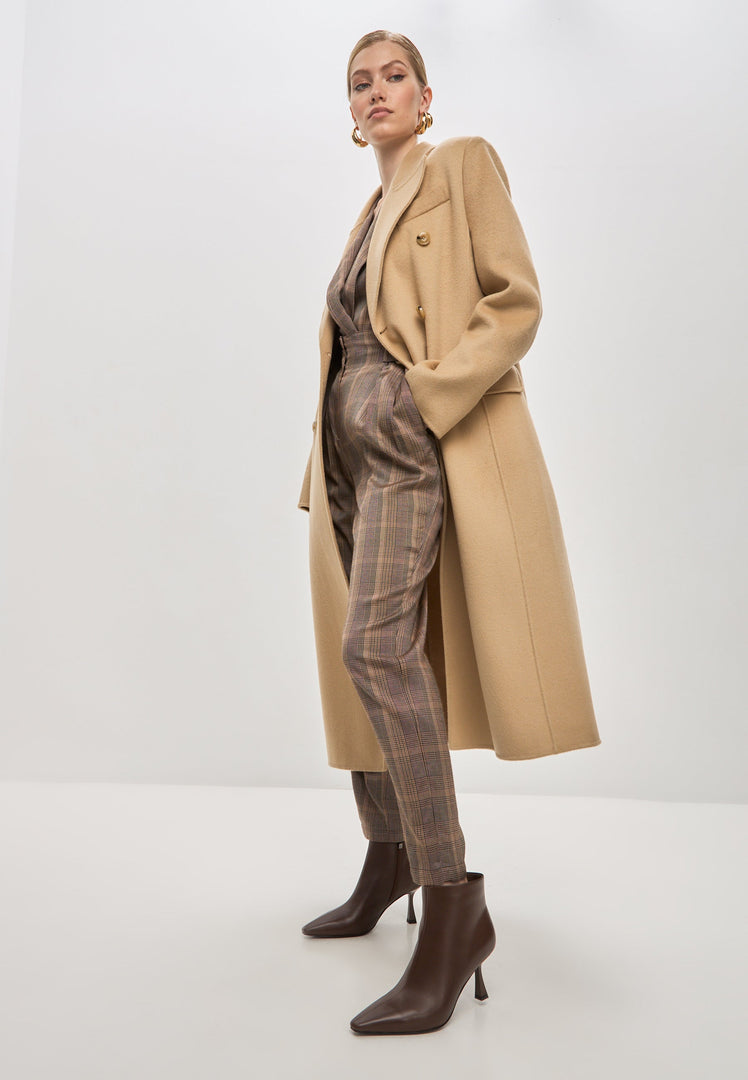 A stylish pair of brown stiletto heel ankle boots, known as Amy ankle boots, perfect for fashion-forward women.