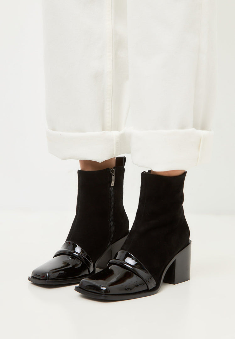 A stylish pair of black block heel ankle boots, the Wren ankle boots, perfect for any outfit.