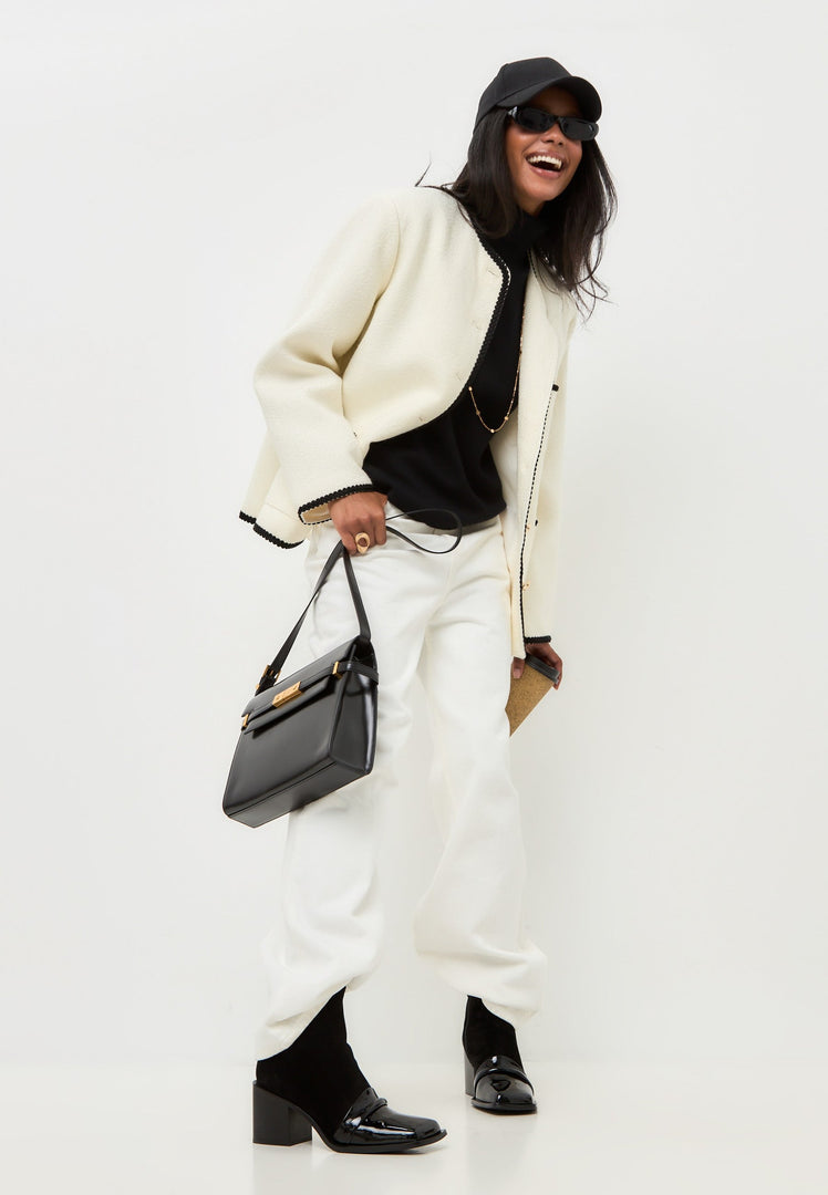 A stylish pair of black Wren block heel ankle boots, perfect for any fashion-forward woman's wardrobe.