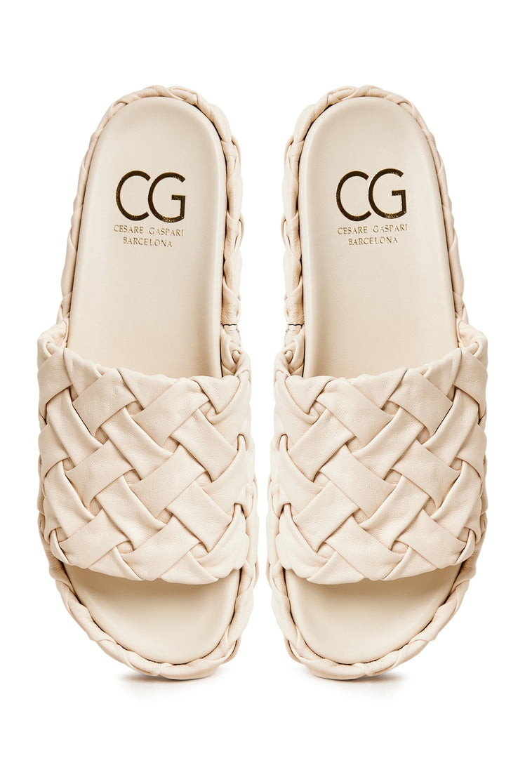 A fashionable pair of beige platform slippers, the Antonella platform sandals, perfect for women looking for trendy and stylish beige footwear.