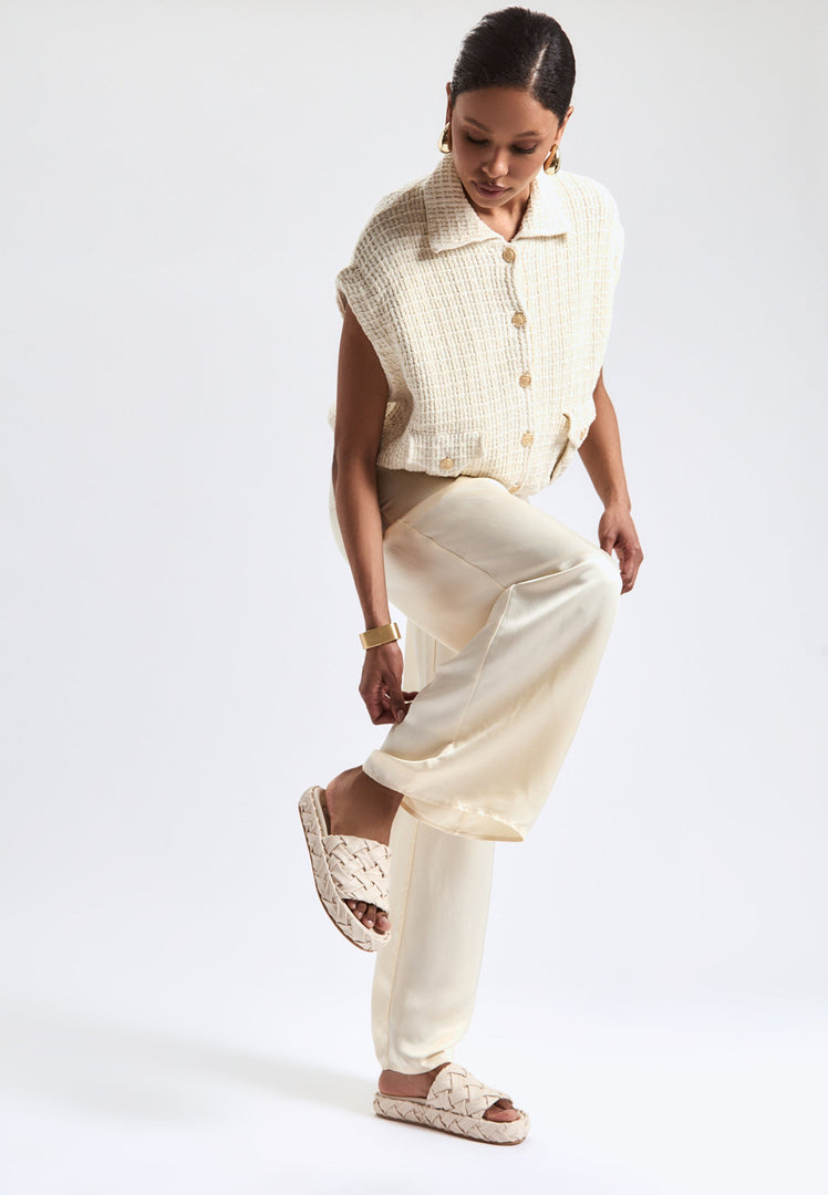 A pair of stylish beige platform slippers, known as Antonella platform sandals, for women - a trendy and fashionable choice in platform footwear.