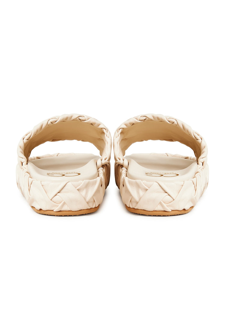 A close-up image of stylish beige platform slippers, the Antonella platform sandals for women, representing trendy and fashionable platform footwear.